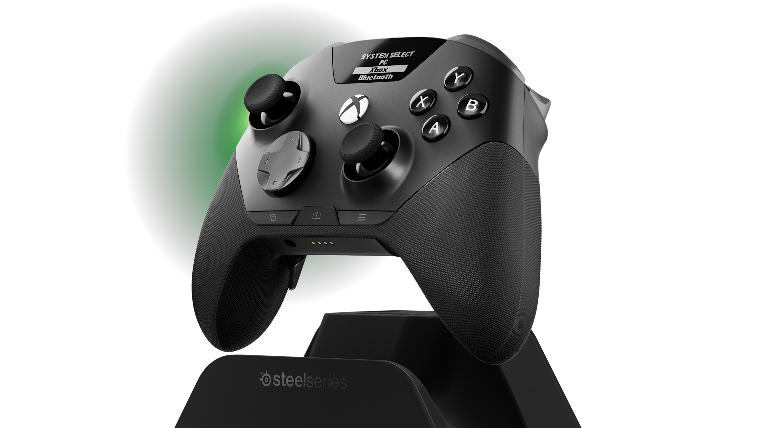 Manette SteelSeries Aeon Pro noire au-dessus de son dock, avec le menu PC, Xbox et Bluetooth visible sur son écran OLED.
