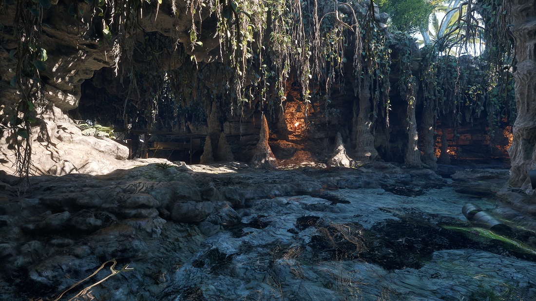 Une grotte végétalisée éclairée par le soleil et des lumières chaudes dans Enlisted, avec PTGI activé.