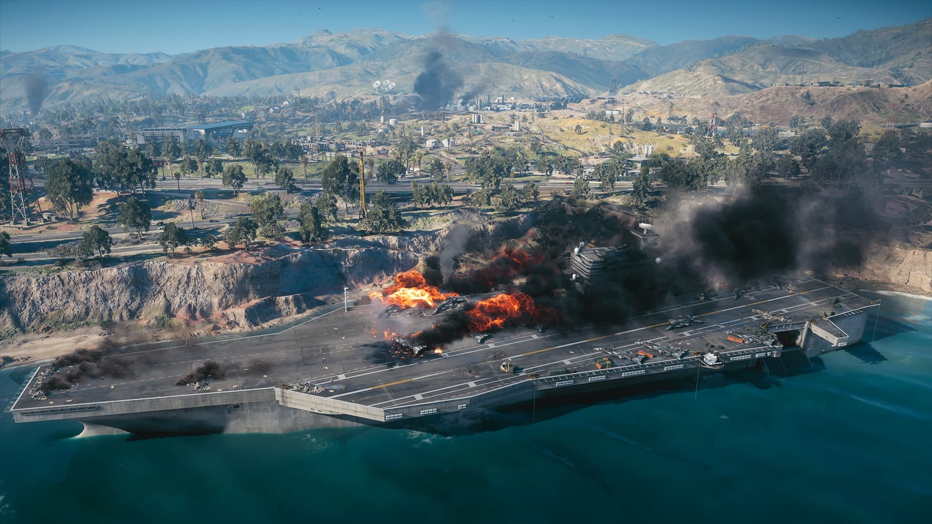 Porte-avions officiel en flammes pendant une partie de Carrier Strike dans Battlefield 6.