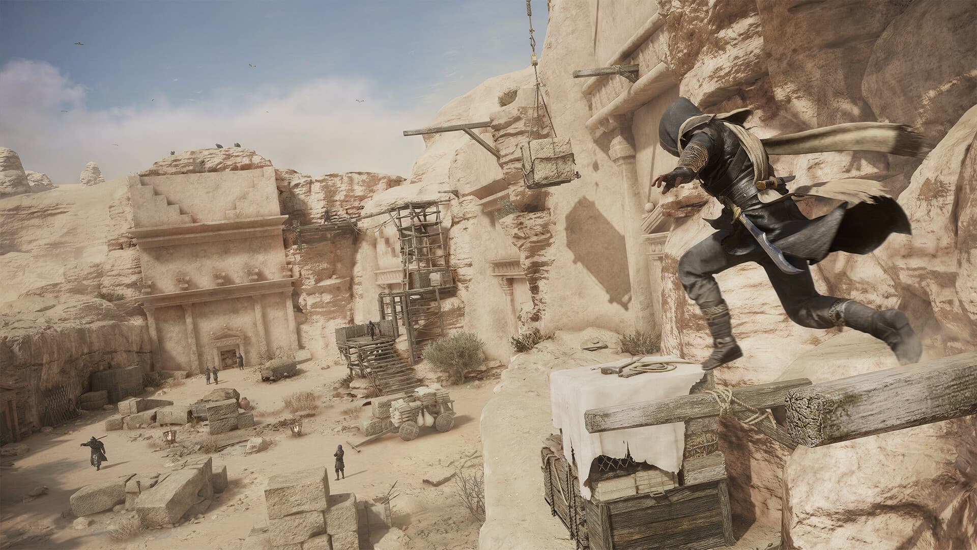 Capture officielle d’Assassin’s Creed Mirage montrant Basim traversant un site rocheux.