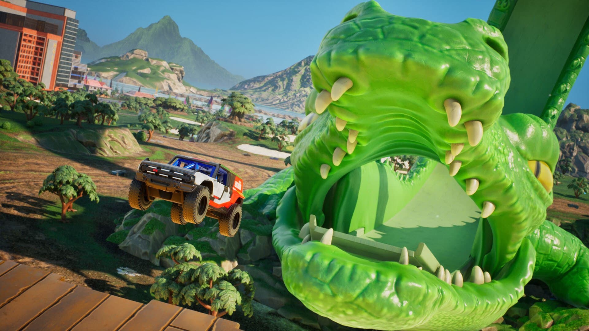 Un véhicule tout-terrain Hot Wheels bondit devant une grande créature verte dans une capture officielle.
