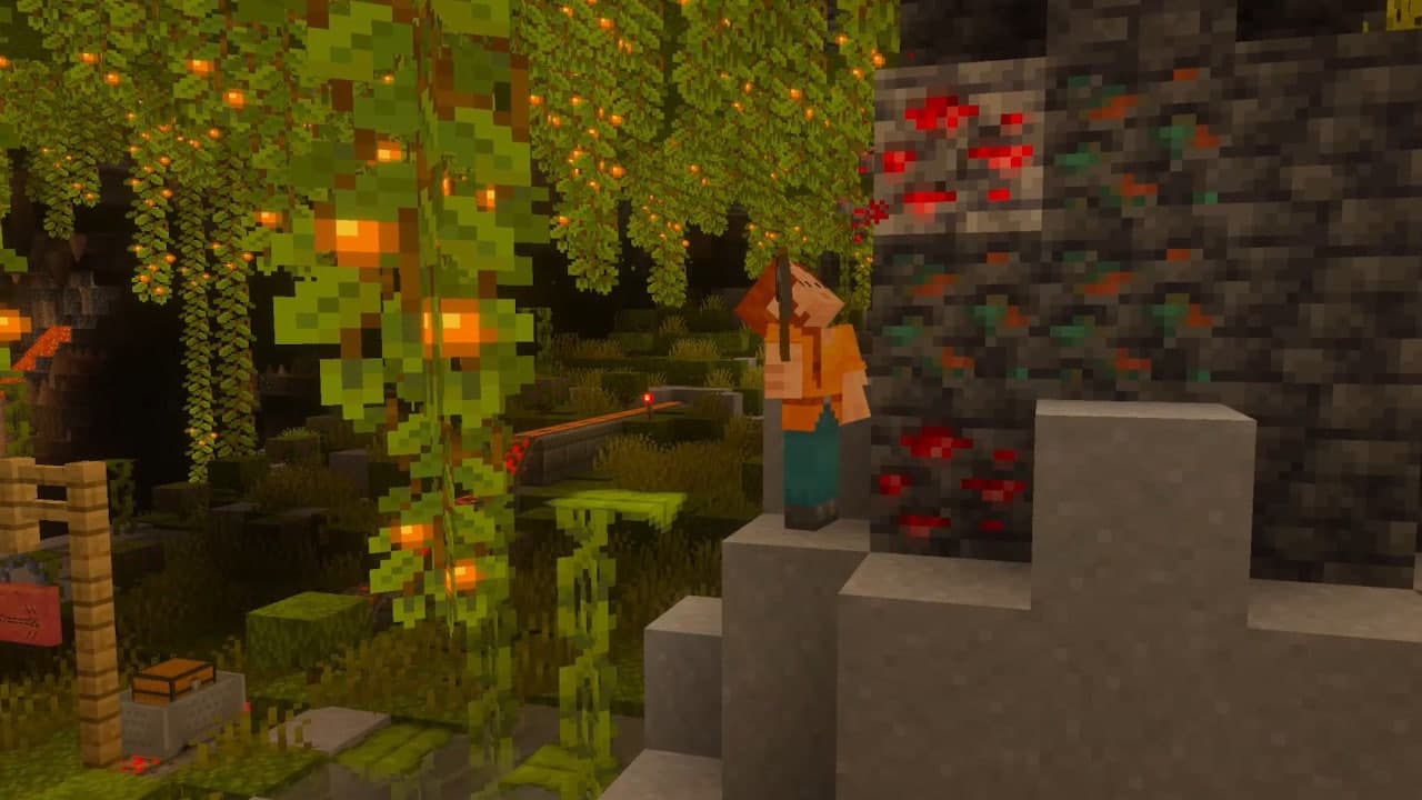 Capture officielle d’une grotte luxuriante dans Minecraft avec des lianes lumineuses, des minerais et un éclairage contrasté.