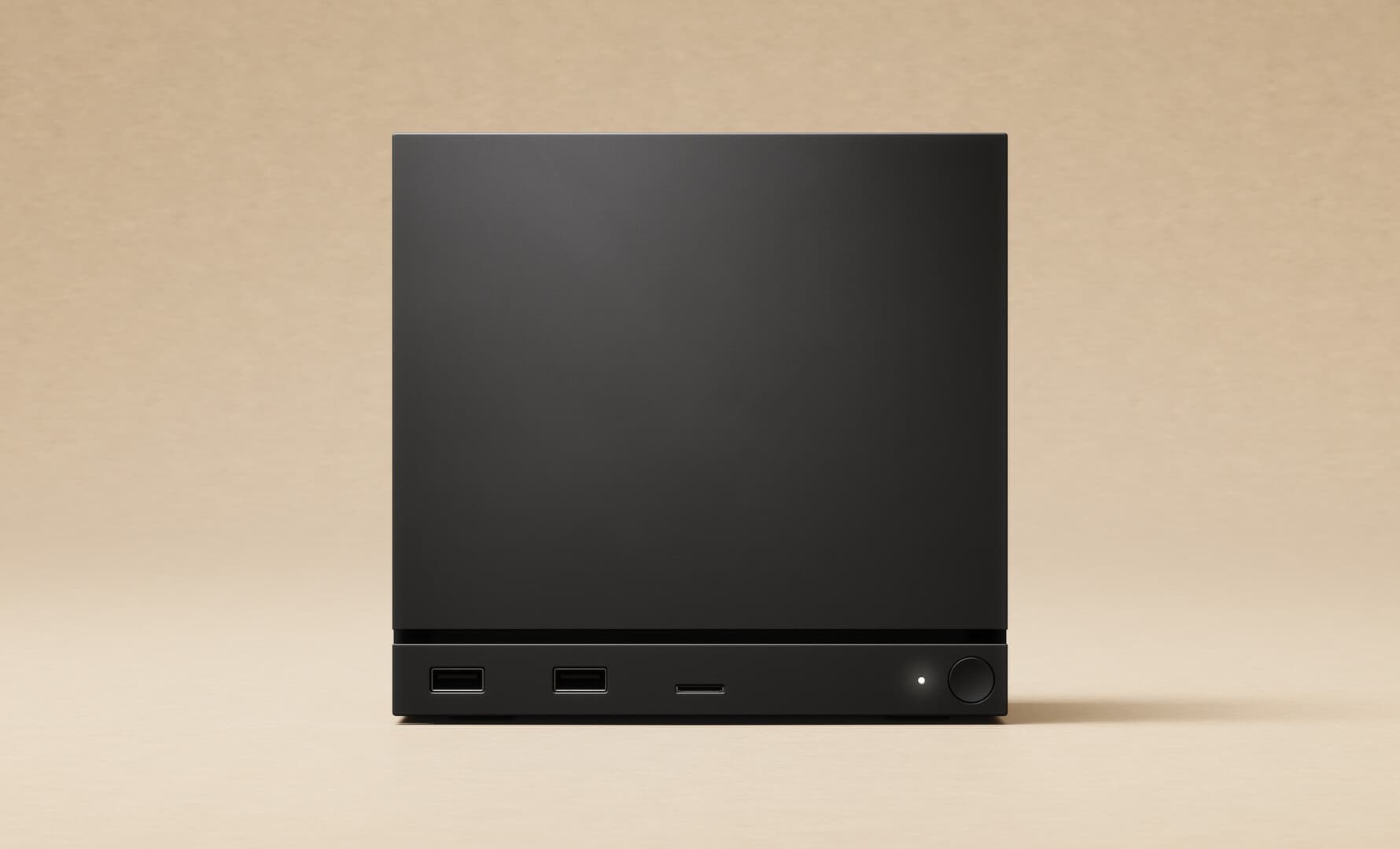 Vue de face officielle de la Steam Machine noire de Valve.