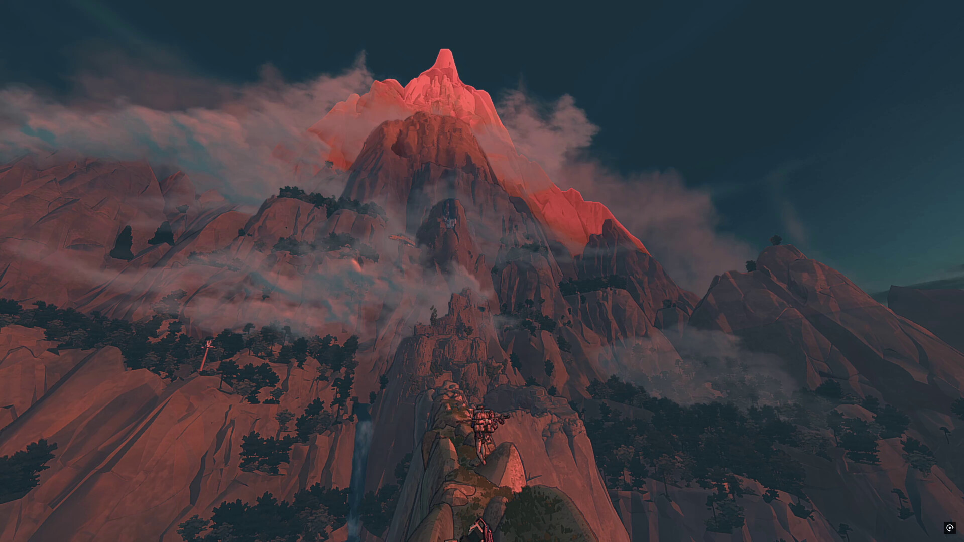 Le sommet du mont Kami émerge de nuages rouges.