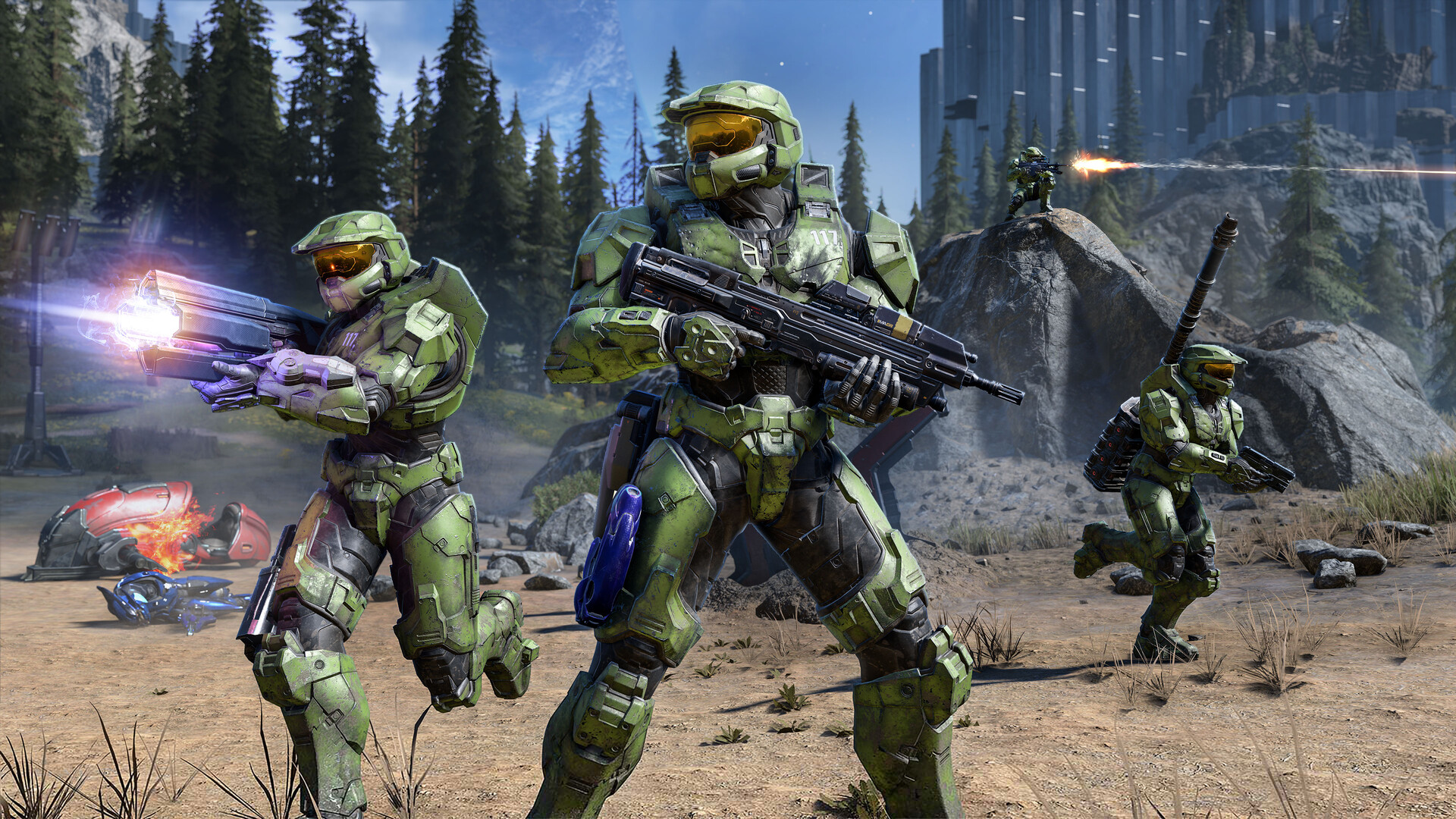 Campagne de Halo Infinite : plusieurs Spartans en armure verte combattent ensemble dans un environnement boisé.