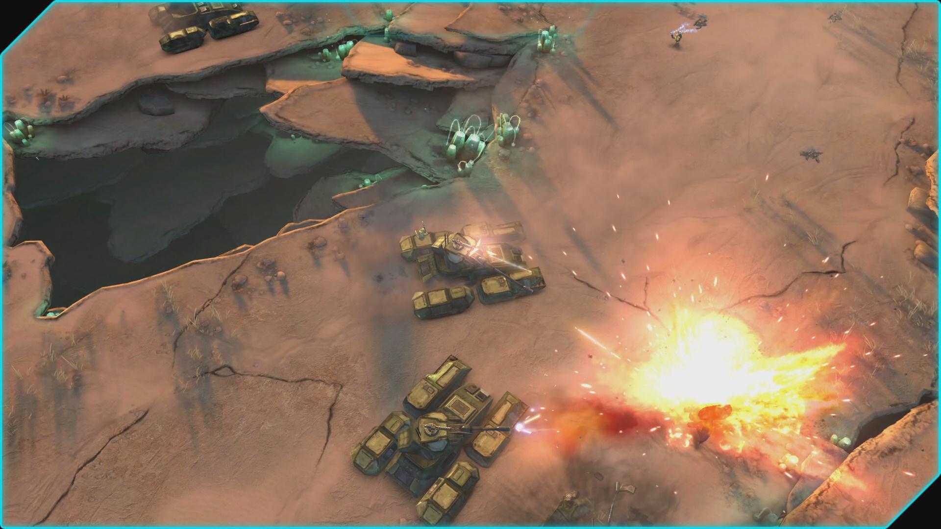 Capture de la version Xbox : deux chars de l’UNSC combattent au bord d’une faille dans le désert.