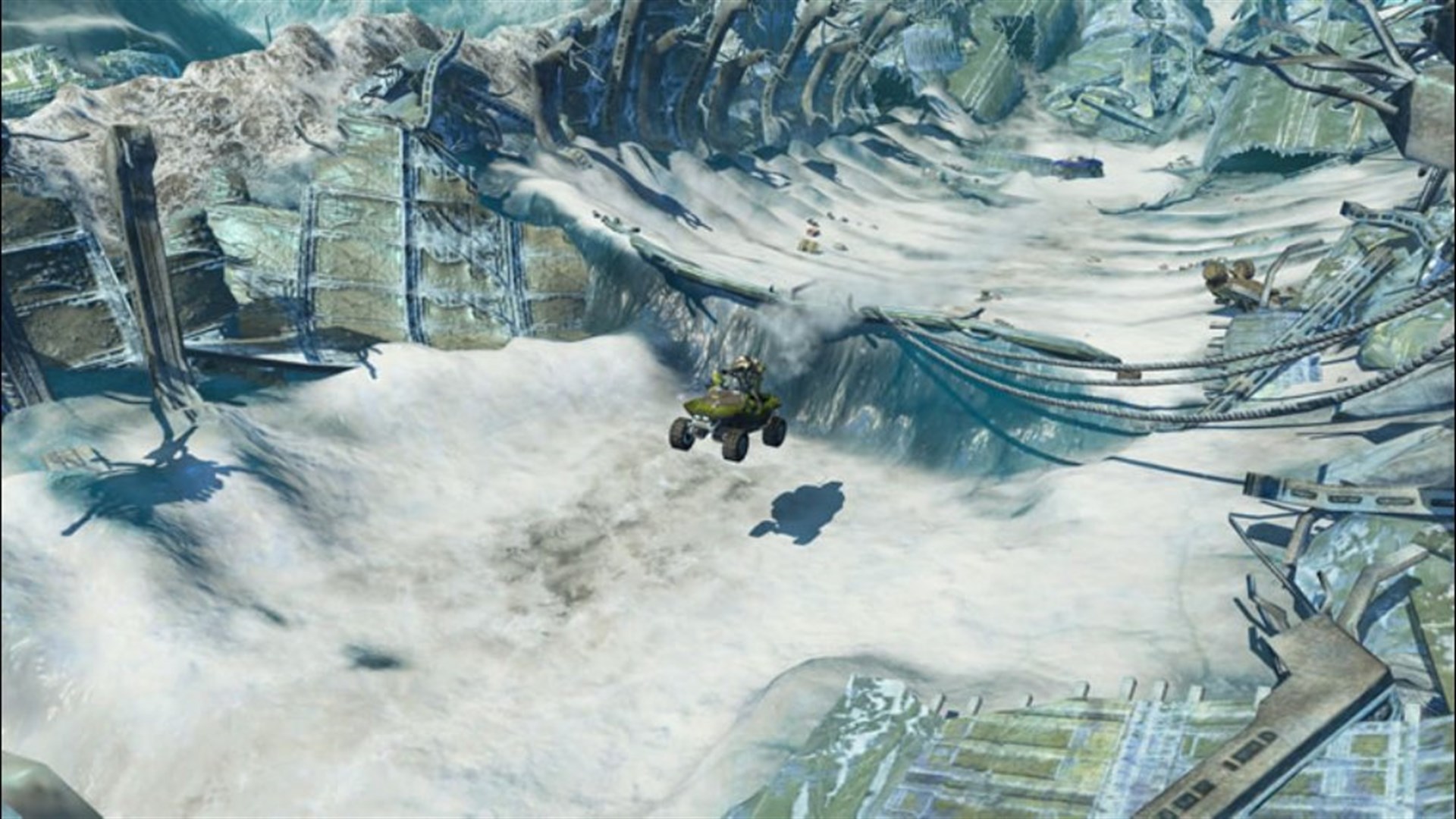 Capture officielle de Halo Wars sur Xbox 360 : un Warthog franchit un relief devant des ruines enneigées.