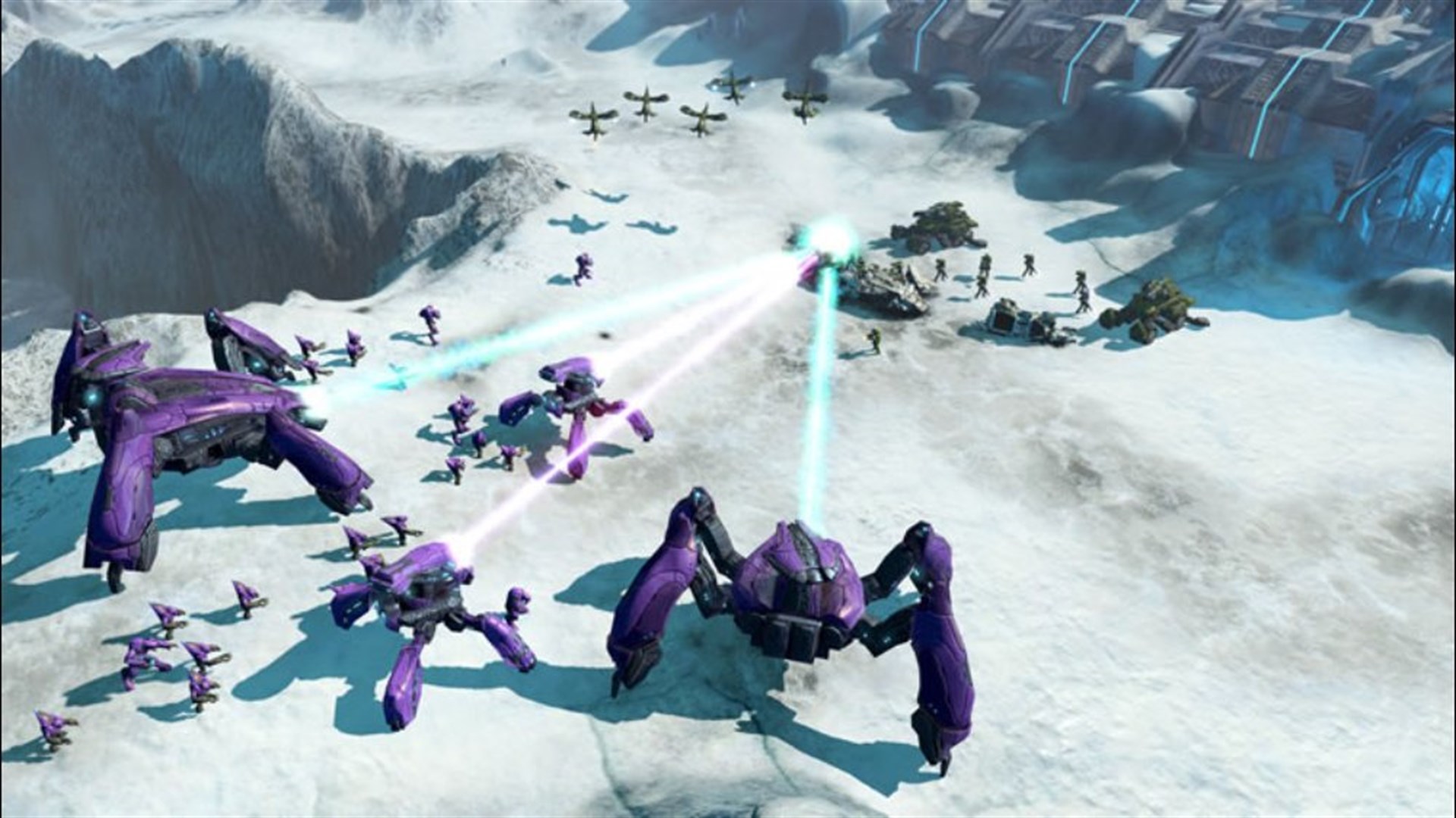 Capture officielle de Halo Wars sur Xbox 360 : un Scarab et des véhicules covenants affrontent l’UNSC dans la neige.