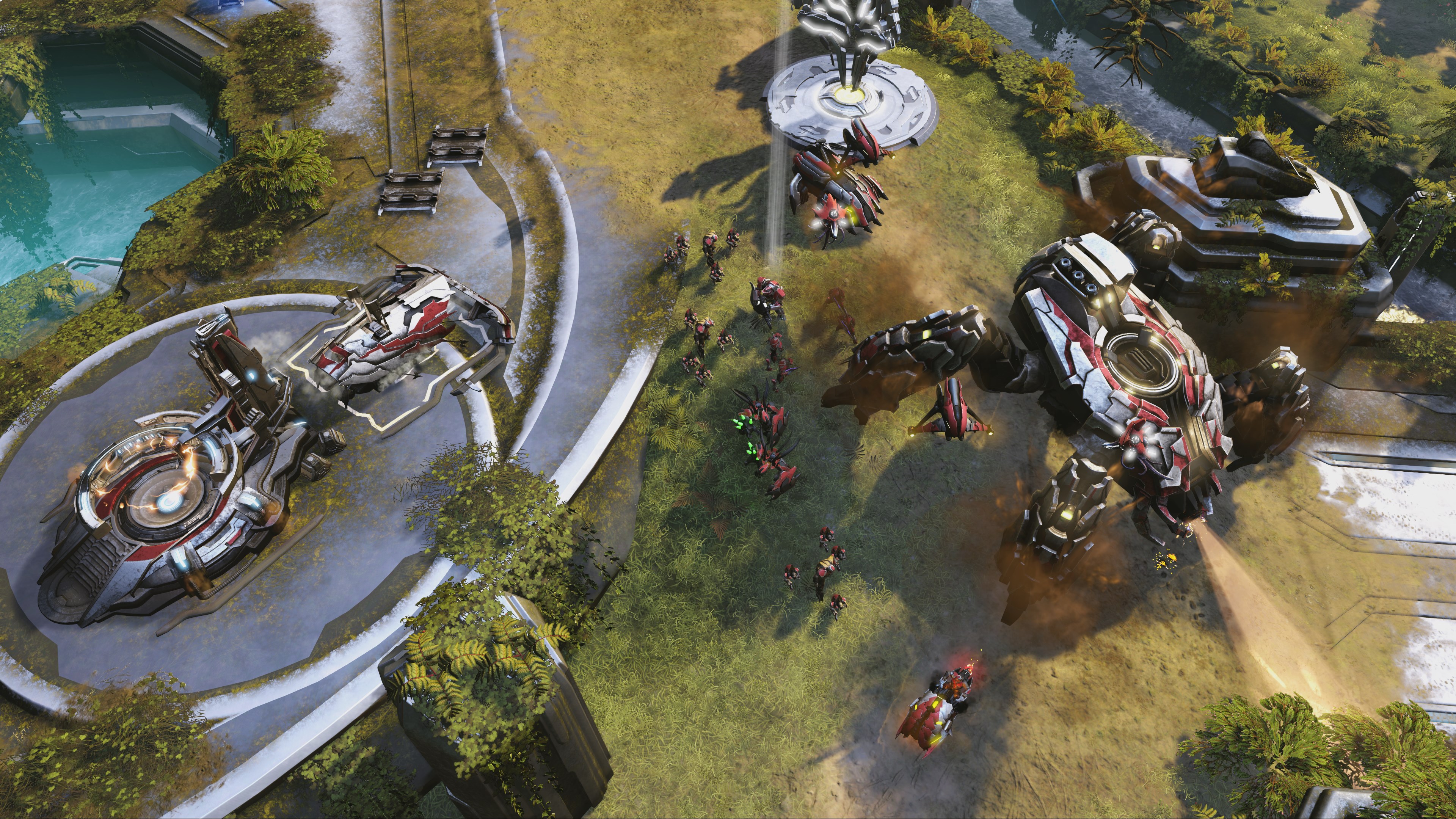 Un Scarab et plusieurs bâtiments des Parias occupent une base construite entre des falaises.