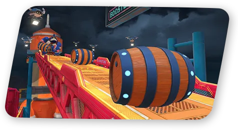 Des tonneaux roulent sur un parcours industriel de Mario Kart World.