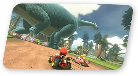 Mario conduit son kart au pied de grandes structures végétales.