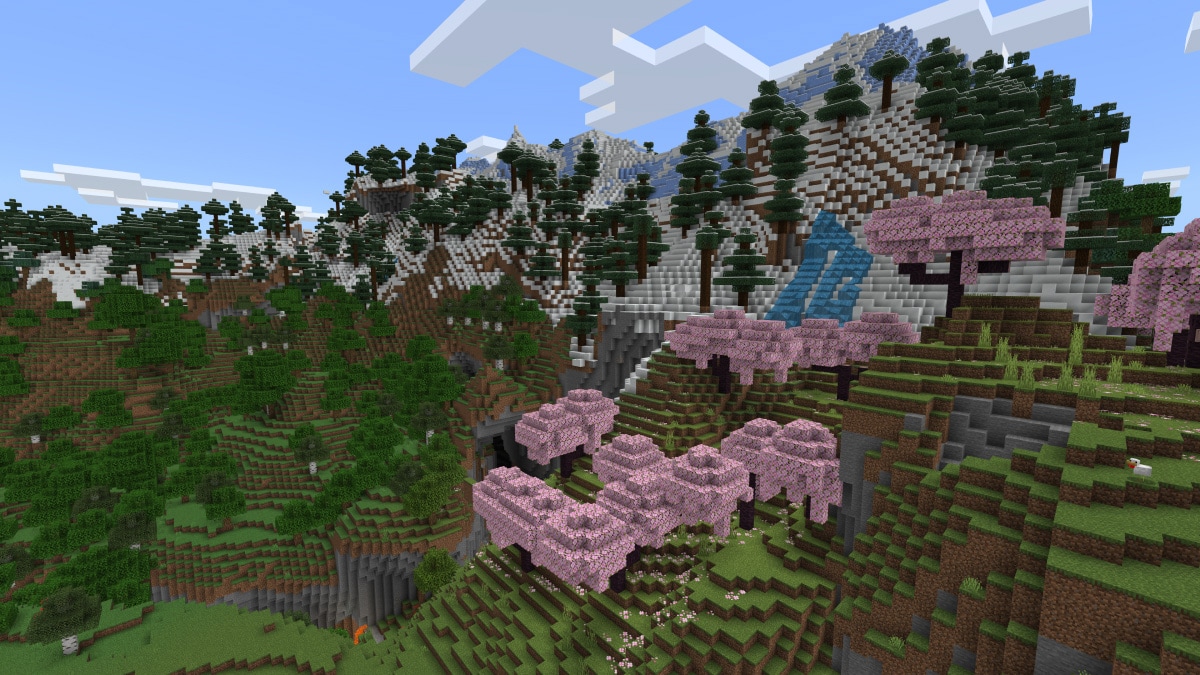 Une montagne boisée et un bosquet de cerisiers dans Minecraft.
