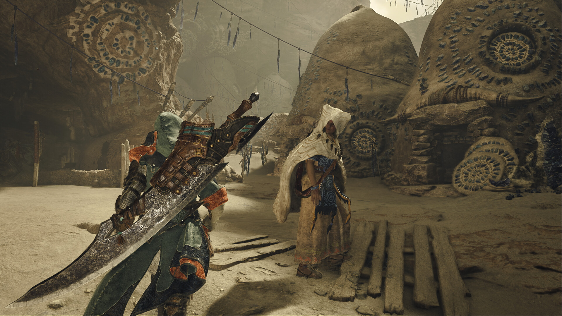 Un chasseur et un habitant se tiennent devant des constructions arrondies.