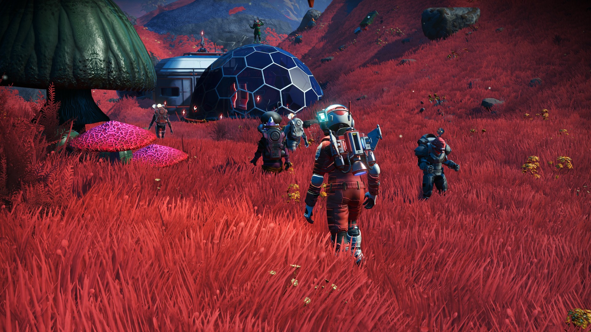 Deux explorateurs approchent une base dans une prairie rouge.