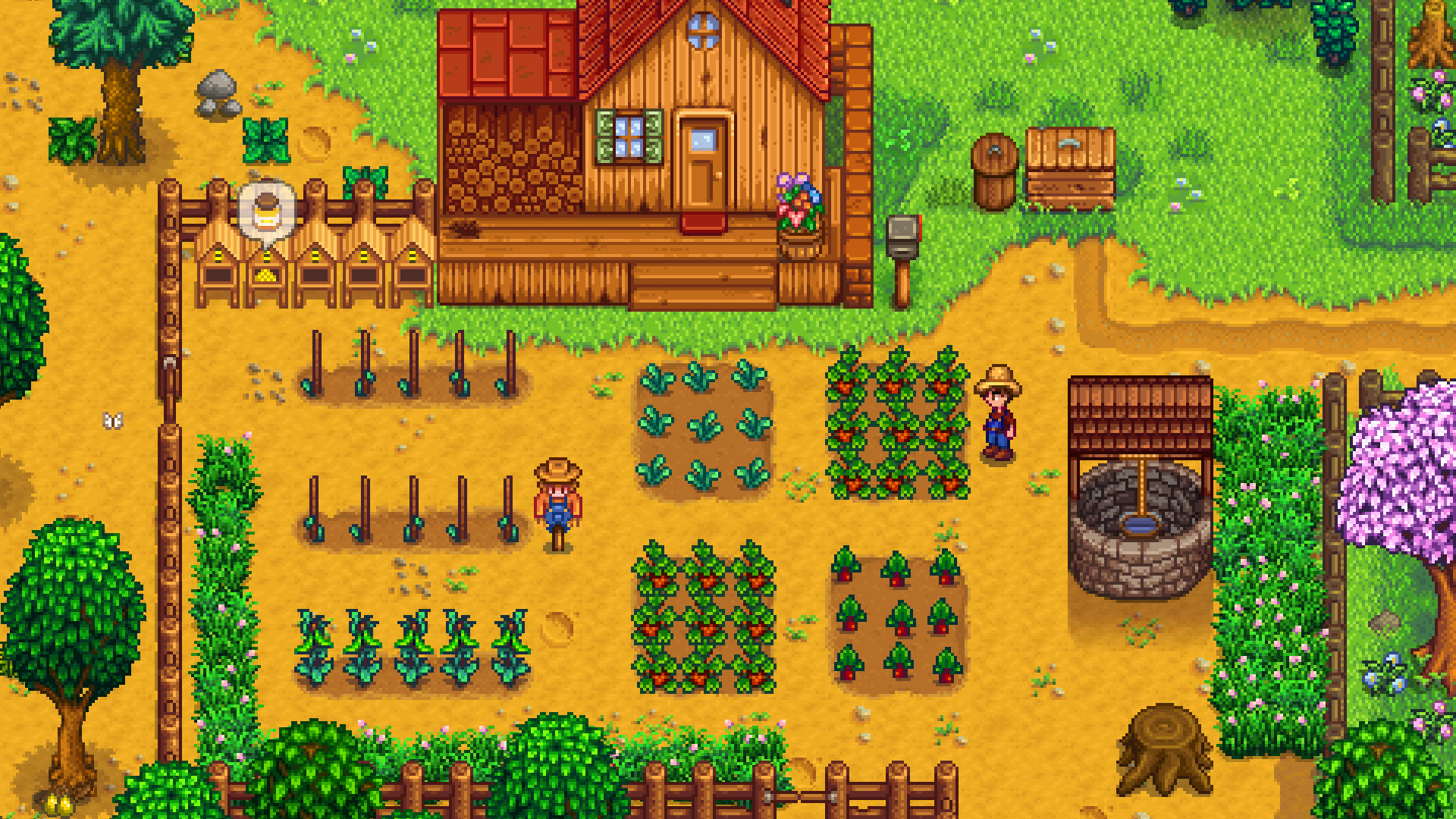 Un jardin cultivé entoure une maison de ferme.