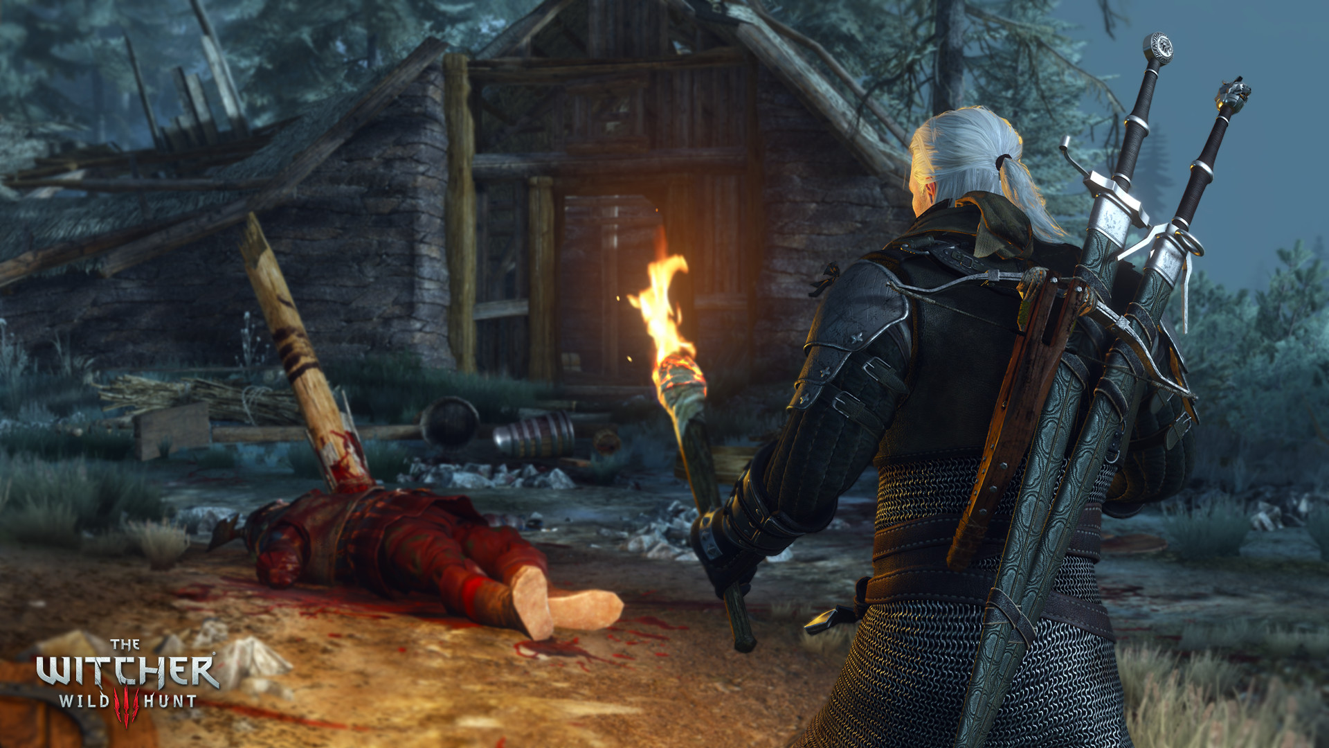 Geralt tient une torche près d’un corps devant une cabane.