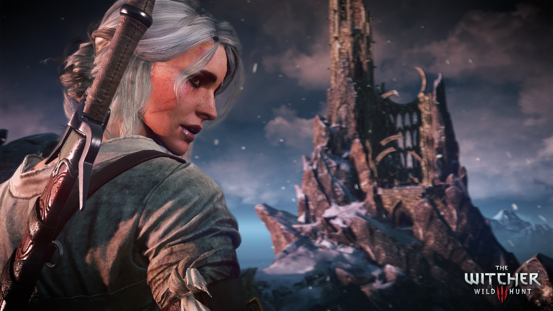 Ciri regarde derrière elle dans un paysage rocheux.