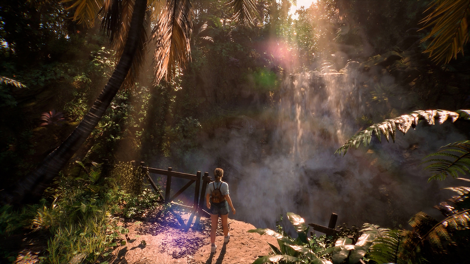 Un personnage approche une cascade dans une forêt.