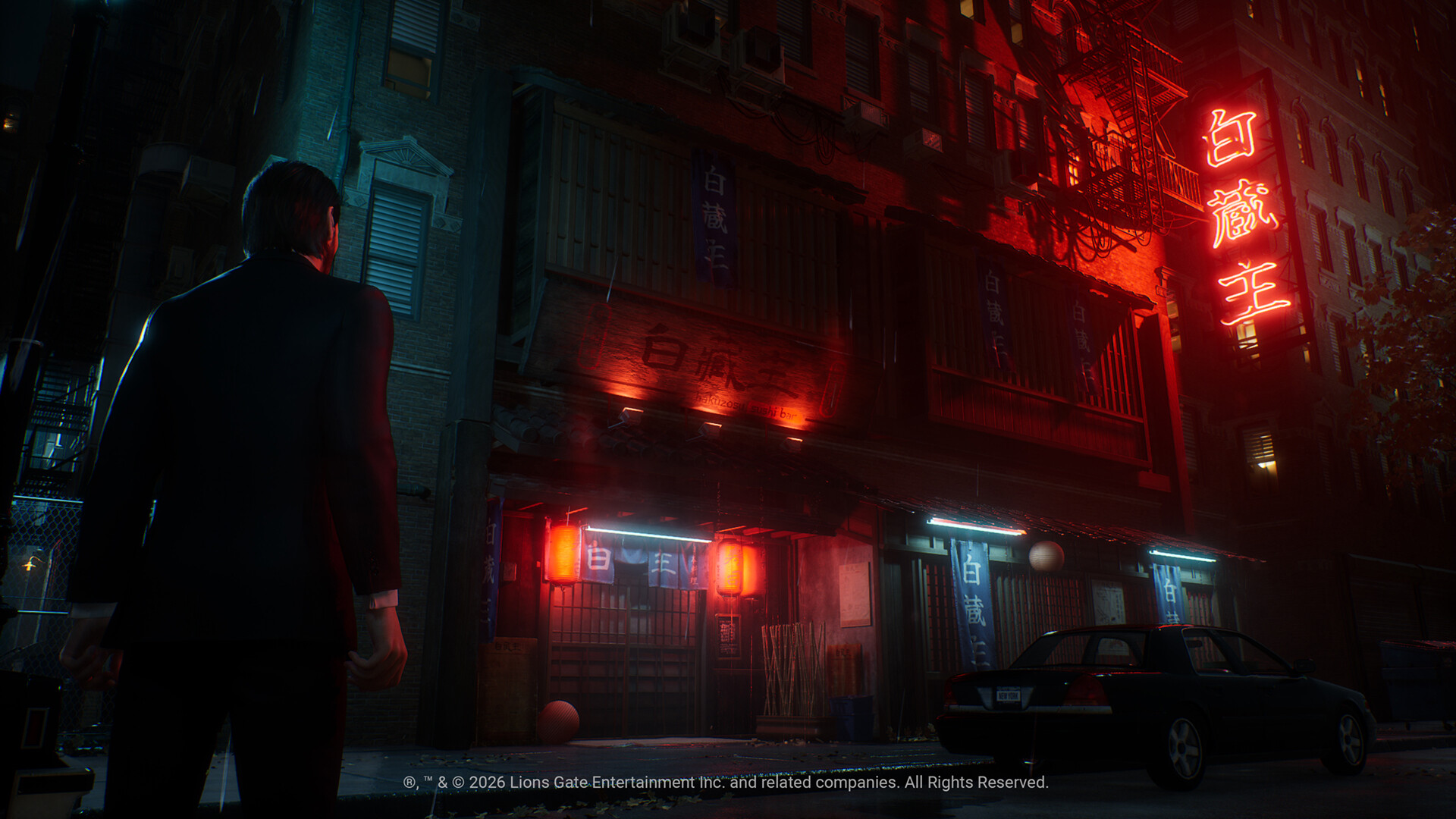 Visuel officiel du jeu John Wick : rue nocturne aux enseignes rouges.