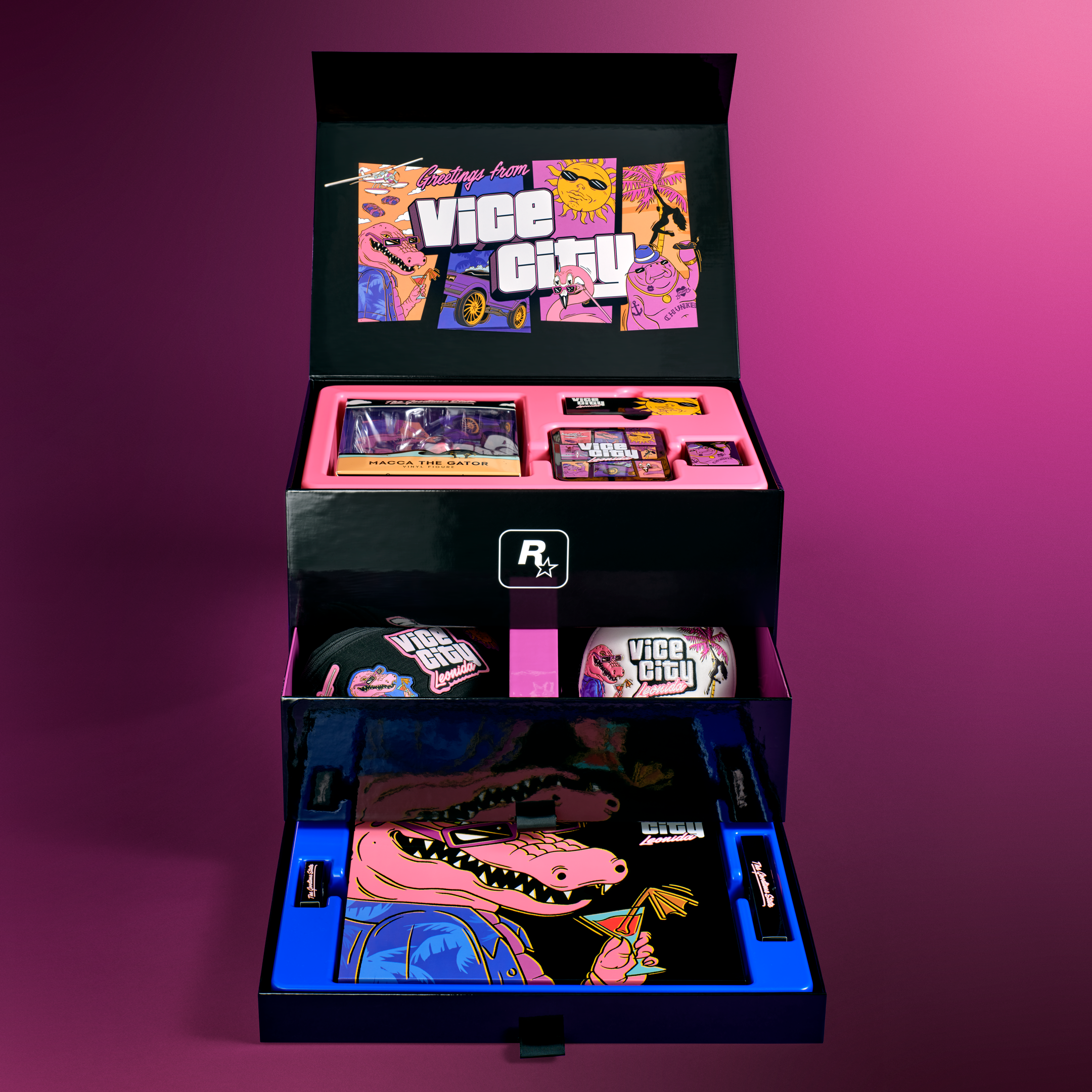 Coffret GTA VI Vice City Collection ouvert, montrant ses compartiments et plusieurs accessoires.